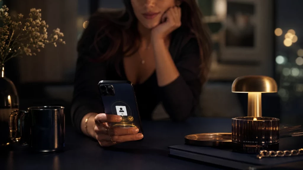 Editorial photo of a woman checking verified dating-profile trust signals on her phone before a date.